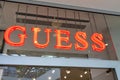 Guess storefront text and logo signboard shop sign on entrance facade store luxury clothing