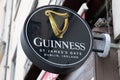 guinness beer sign text and logo brand on facade wall facade pub bar