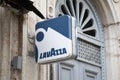 Lavazza logo brand and sign text of coffee signboard wall bar building facade and entrance