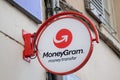 MoneyGram brand money transfer sign text and logo front wall facade agency shop money gram