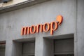 Monop\' logo sign on wall shop supermarket of french city store retail brand text chain signboar