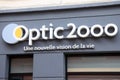 Optic 2000 logo facade wall sign text on store street brand facade Optician glasses