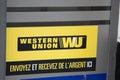 Western Union wu sign text and brand logo entrance facade office company american financial