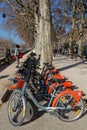 Park for public bikes, called her velo\'v, on the Rhone river banks Royalty Free Stock Photo