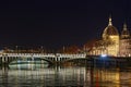 Rhone river and lighten Hotel Dieu buildings at night Royalty Free Stock Photo