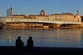 Silhouettes of young people on the banks of the Rhone river
