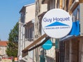 Logo of Guy Hoquet Immobilier in front of their real estate broker in Lyon. Guy Hoquet is a network chain of real estate agents