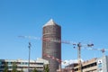 Tour Part Dieu, also called Le Crayon or Credit Lyonnais tower, with cranes from a construction site in Front.