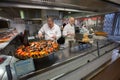 Lyon Market Paul Bocuse. Cooking seafood