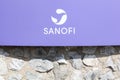 Sanofi logo on a wall