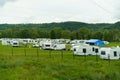 Parking for motorhomes in a campsite near the forest. Rest and travel in a motor home.
