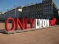 The touristic sign of the town of Lyon in France on the town square with the city hall in the back Royalty Free Stock Photo