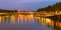 Panorama of the Saone docks illuminated at dusk, in Lyon, in the Rhone, France
