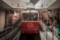 Lyon Funicular Railway entering the station of Old Lyon with tourists preparing to enter, before bringing them to Fourviere Hill Royalty Free Stock Photo