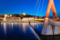 Lyon night cityscape with illuminated Courthouse and red pedestrian bridge over Saone river. Panoramic Royalty Free Stock Photo