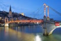 Lyon with Saone river and footbridge at night Royalty Free Stock Photo