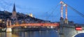 Lyon with Saone river and footbridge at night Royalty Free Stock Photo