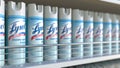 Lysol disinfectant spray cans on a store shelf, editorial 3D rendering. COVID-19 coronavirus disease preventive measures Royalty Free Stock Photo