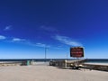 Sign and poster for COVID-19 at the Glenelg Jetty