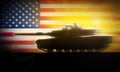 M1A2 Abrams tank moves rapidly against the background of the US flag.