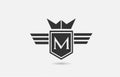 M alphabet letter logo icon for company in black and white. Creative badge design with king crown wings and shield for business