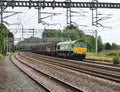 DB Cargo Class 66 66004 working a Dollands Moor Sidings to Ditton Foundry Lane approaches Rugeley Trent Valley on 28 June 2023