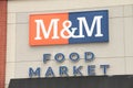 tor, canada - august 18, 2023: m and m food market sign logo on front of store exterior, orange blue white 63 p 20