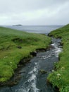 MÃºlafossur river stream before it falls into the sea, VÃ¡gar, Faroe Islands Royalty Free Stock Photo