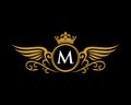 M letter initial with wings and crown crest