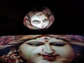 Maa Durga on spoon ,reflection from Mobile display Royalty Free Stock Photo
