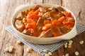 Maafe Beef Stew in peanut sauce close-up in a dish. Horizontal