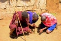 Maasai men lighting fire, Kenya Royalty Free Stock Photo