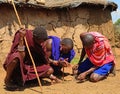 Maasai men lighting fire, Kenya Royalty Free Stock Photo