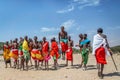 Maasai people are dancing and celebrating outdoors