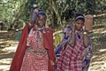 Maasai women carrying water at home