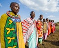 Maasai women together singing ritual songs in traditional dress.