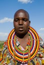 Maasai women together singing ritual songs in traditional dress.