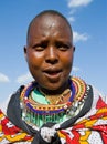 Maasai women together singing ritual songs in traditional dress.