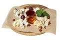 Maasdam, brie, camembert, roquefort cheeses on cheese board served with grapes Royalty Free Stock Photo