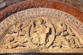 Carvings representing the Christ tympanum located above the access door from the cloister to the church