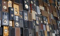 View on isolated wall many stacked music vintage loudspeaker boxes Royalty Free Stock Photo