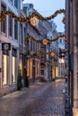 Illuminated Stokstraat with christmas ornaments for holiday seasons in Maastricht