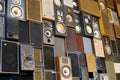 View on isolated stack of many vintage retro loudspeakers