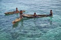 MABUL ISLAND, SABAH. local sea kids playing around at crystal clear water at Mabul Island