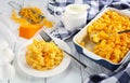 Mac and Cheese in baking dish and on plate Royalty Free Stock Photo