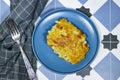 Mac and cheese. traditional american dish macaroni pasta and a cheese sauce on tiles background.