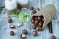 Macadam nuts, walnut oil, on wooden background. Relax, health care, body care Royalty Free Stock Photo