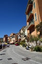 Macadam road with houses and restaurants in Villefranche Sur Meer in France Royalty Free Stock Photo