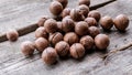 Macadama nuts on a wooden rustic background. Vegetable protein source