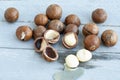 Macadamia is an Australian nut, a Kindal. On a wooden fob is a gray-blue color Royalty Free Stock Photo
